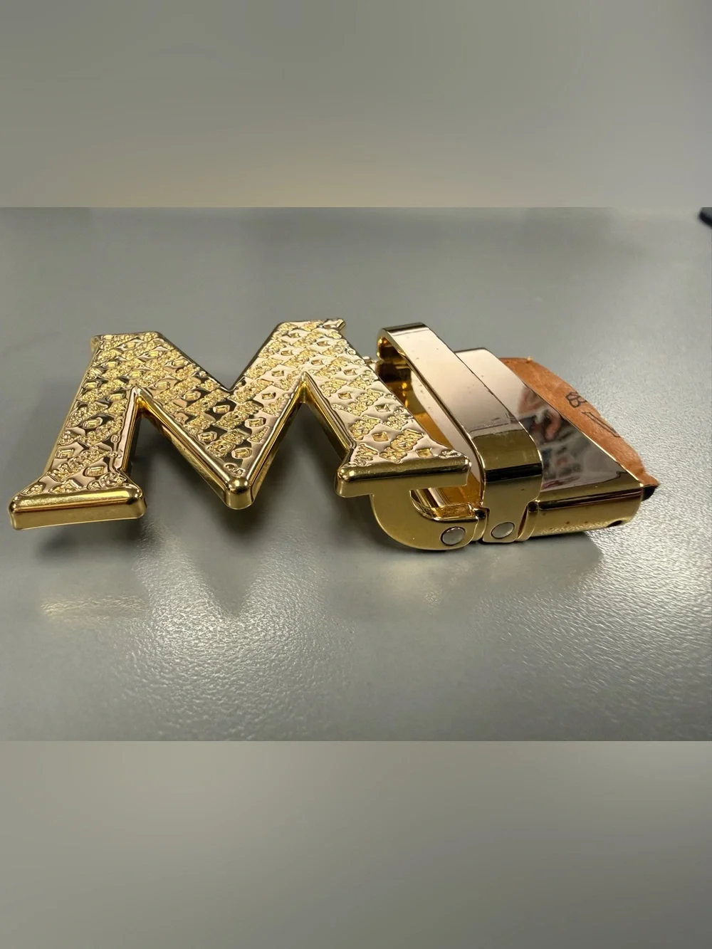 MCM Gold Tone Initial “M” Automatic Ratchet Belt Buckle Designer Logo